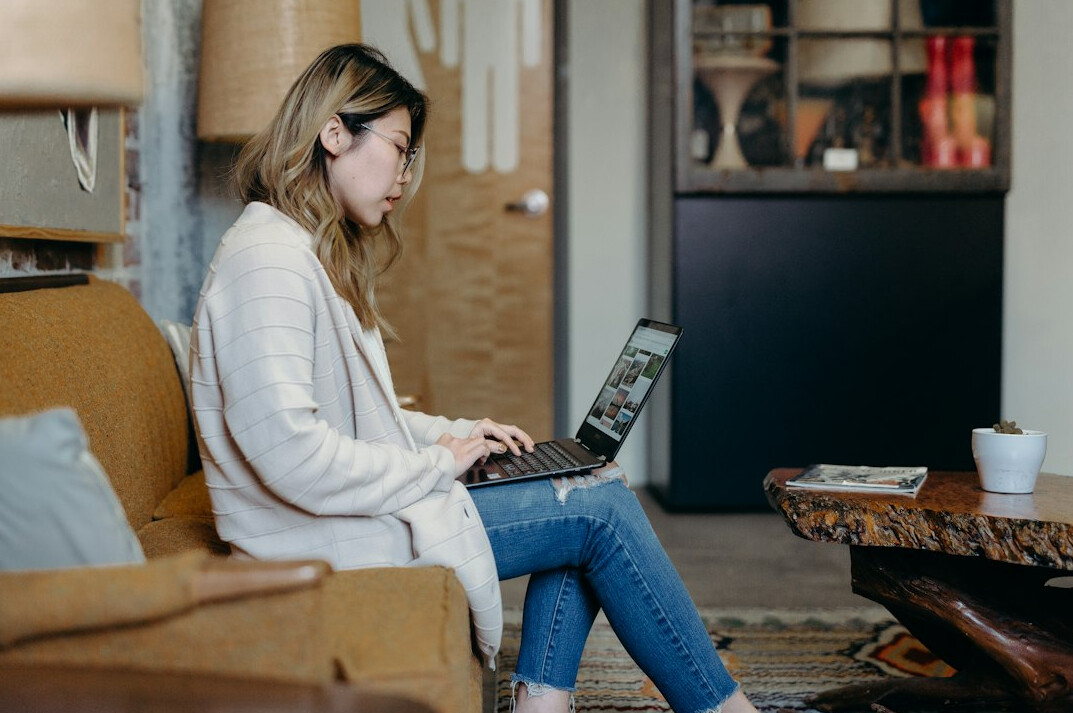 woman working on laptop at home